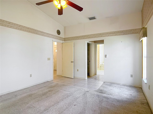 6147 N Whispering Oak Loop, Beverly Hills, FL 34465 - unfurnished bedroom with light colored carpet, light tile patterned floors, ceiling fan, baseboards, and a towering ceiling