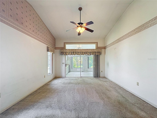 6147 N Whispering Oak Loop, Beverly Hills, FL 34465 - spare room with a ceiling fan, light carpet, high vaulted ceiling, and baseboards
