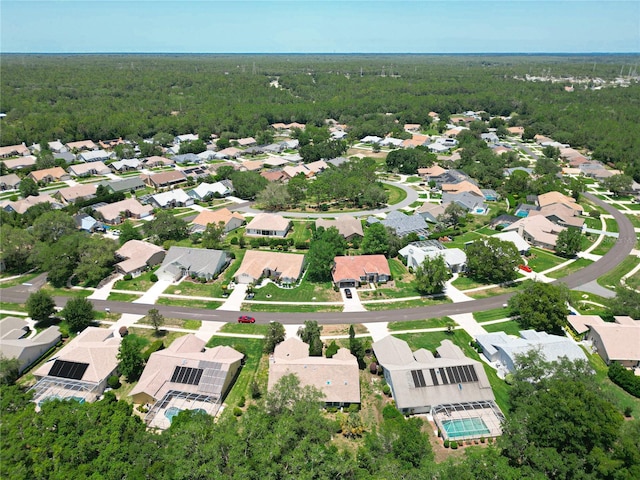 6147 N Whispering Oak Loop, Beverly Hills, FL 34465 - aerial perspective of suburban area with a heavily wooded area
