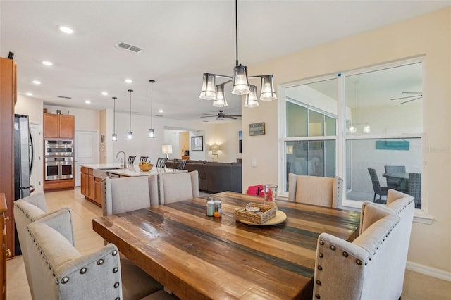 dining room featuring a ceiling fan, recessed lighting, and baseboards