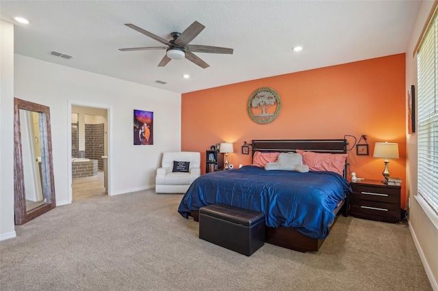 carpeted bedroom featuring baseboards, recessed lighting, a ceiling fan, and ensuite bath