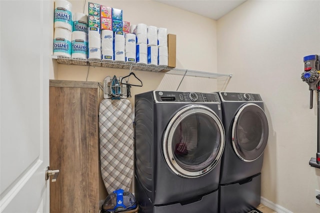 washroom with separate washer and dryer