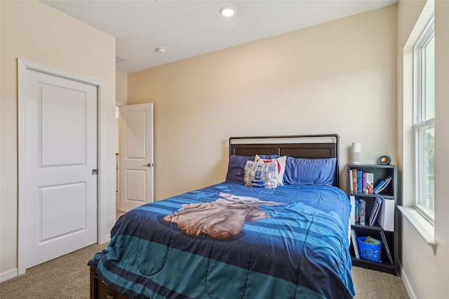 carpeted bedroom with baseboards