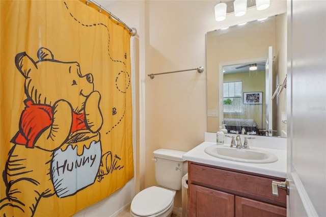 full bathroom with vanity, toilet, ensuite bathroom, and shower / tub combo