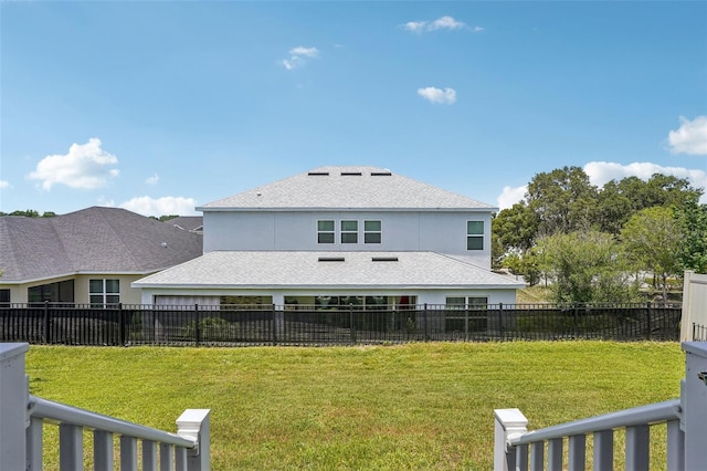 rear view of property featuring a shingled roof