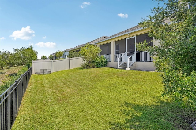 view of yard with a sunroom
