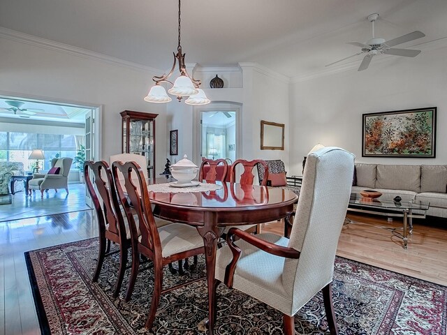 3112 Burbank Ln, The Villages, FL 32162 - dining room with ceiling fan, crown molding, and wood finished floors