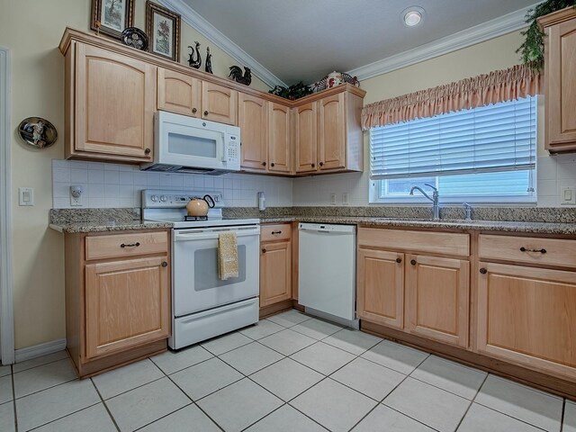 3112 Burbank Ln, The Villages, FL 32162 - kitchen featuring white appliances, light brown cabinets, crown molding, backsplash, and a sink