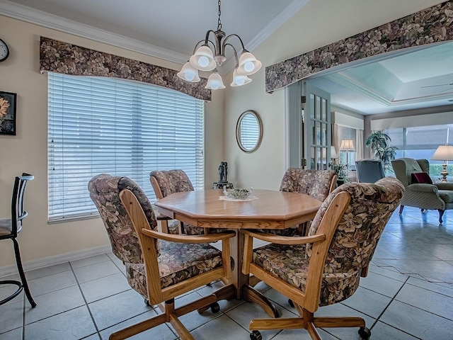 3112 Burbank Ln, The Villages, FL 32162 - dining area with a chandelier, ornamental molding, baseboards, and light tile patterned flooring
