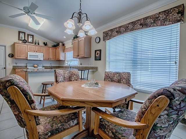 3112 Burbank Ln, The Villages, FL 32162 - dining area with ornamental molding, lofted ceiling, ceiling fan, light tile patterned flooring, and a chandelier