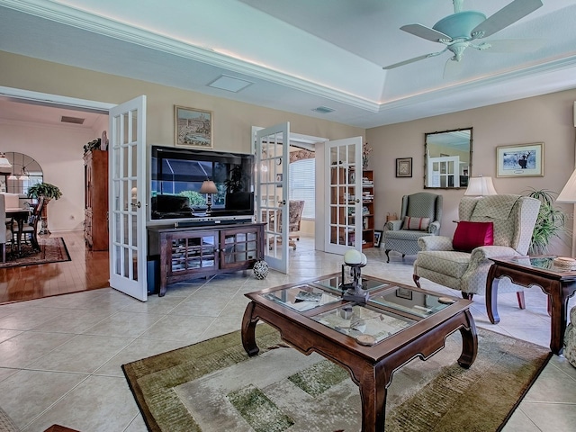 3112 Burbank Ln, The Villages, FL 32162 - tiled living area featuring french doors, a raised ceiling, ceiling fan, and ornamental molding