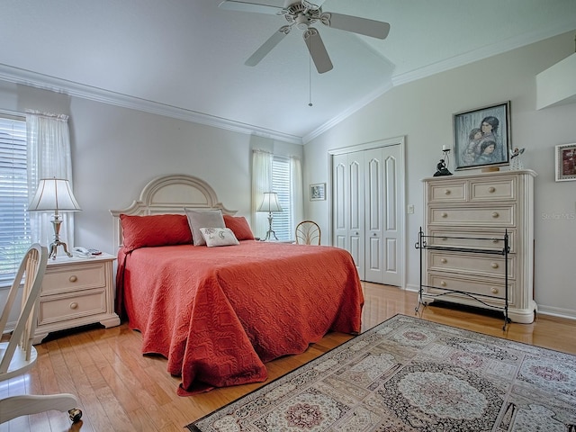 3112 Burbank Ln, The Villages, FL 32162 - bedroom featuring vaulted ceiling, multiple windows, light wood finished floors, ornamental molding, and a closet