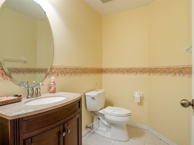 25243 River Crest Dr, Leesburg, FL 34748 - half bathroom featuring toilet, vanity, and tile patterned flooring
