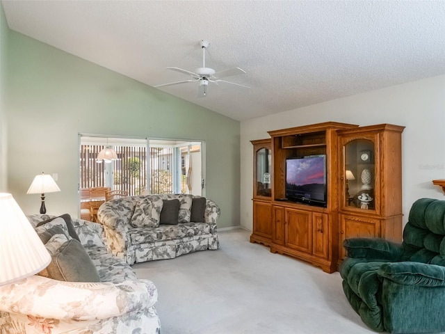25243 River Crest Dr, Leesburg, FL 34748 - living room featuring ceiling fan, light colored carpet, vaulted ceiling, and a textured ceiling