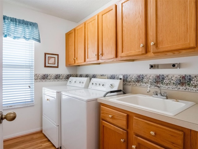 25243 River Crest Dr, Leesburg, FL 34748 - laundry area with washer and dryer, cabinet space, and light wood-style floors