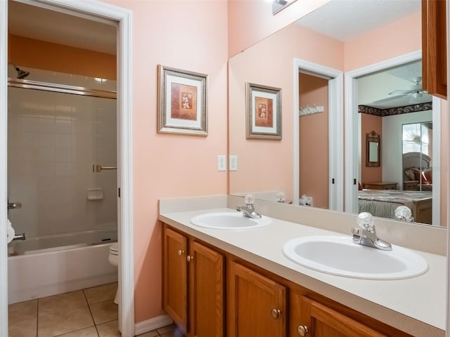 25243 River Crest Dr, Leesburg, FL 34748 - full bathroom with ensuite bathroom, toilet, double vanity, tile patterned flooring, and enclosed tub / shower combo