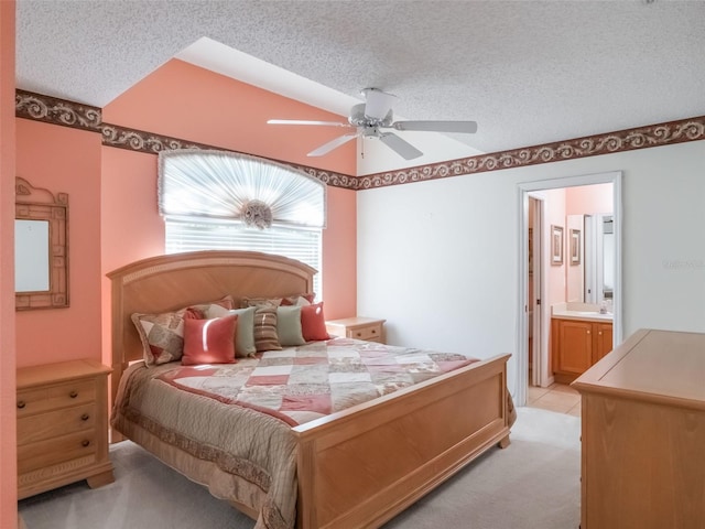 25243 River Crest Dr, Leesburg, FL 34748 - bedroom featuring a textured ceiling, light colored carpet, ensuite bathroom, and a ceiling fan