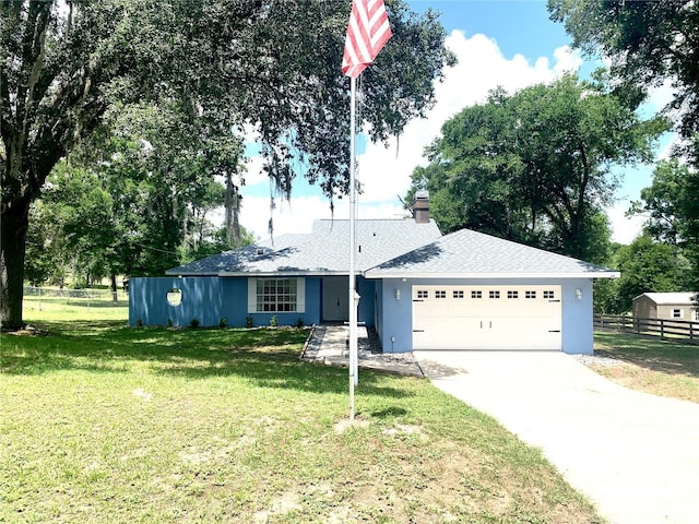 8180 N Duval Dr, Citrus Springs, FL 34434 - ranch-style house featuring a garage and driveway