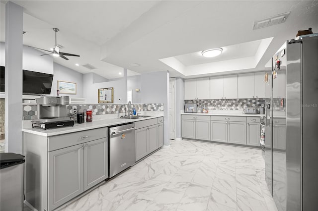 8180 N Duval Dr, Citrus Springs, FL 34434 - kitchen with stainless steel appliances, gray cabinetry, ceiling fan, light marble finish floors, and light countertops