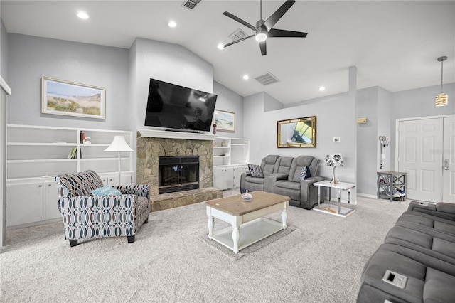 8180 N Duval Dr, Citrus Springs, FL 34434 - carpeted living area featuring a ceiling fan, vaulted ceiling, a fireplace, recessed lighting, and baseboards