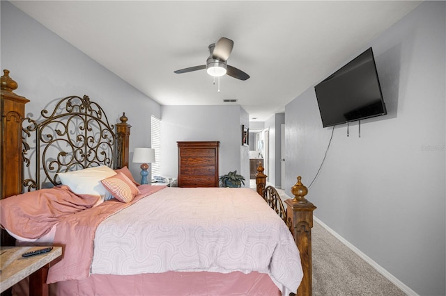 8180 N Duval Dr, Citrus Springs, FL 34434 - bedroom featuring carpet, baseboards, a ceiling fan, and ensuite bath