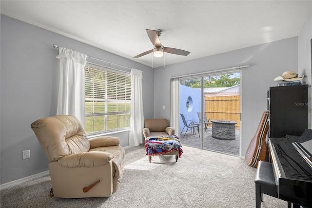 8180 N Duval Dr, Citrus Springs, FL 34434 - sitting room with carpet flooring, ceiling fan, and baseboards