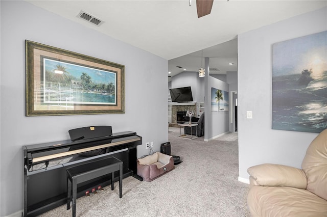 8180 N Duval Dr, Citrus Springs, FL 34434 - sitting room with carpet, baseboards, a stone fireplace, a ceiling fan, and recessed lighting