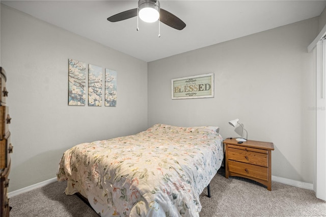 8180 N Duval Dr, Citrus Springs, FL 34434 - bedroom featuring light colored carpet, baseboards, and ceiling fan