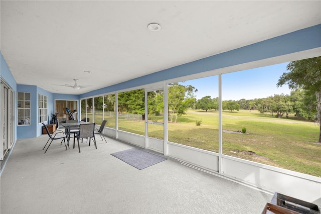 8180 N Duval Dr, Citrus Springs, FL 34434 - sunroom featuring a ceiling fan and outdoor dining space