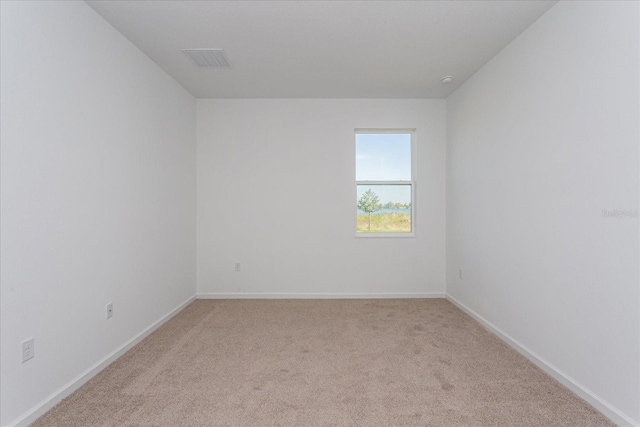 5017 Balsam Falls Rd, Deland, FL 32724 - unfurnished room featuring light carpet and baseboards