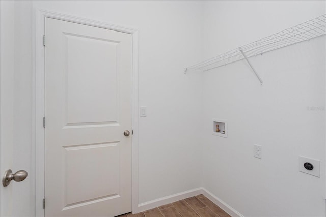 5017 Balsam Falls Rd, Deland, FL 32724 - washroom featuring electric dryer hookup, hookup for a washing machine, baseboards, and wood finished floors