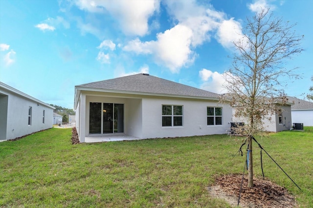 5009 Balsam Falls Rd, Deland, FL 32724 - back of house featuring stucco siding, a lawn, cooling unit, and a shingled roof