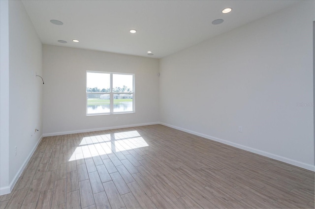 5009 Balsam Falls Rd, Deland, FL 32724 - unfurnished room with light wood-style floors, baseboards, and recessed lighting
