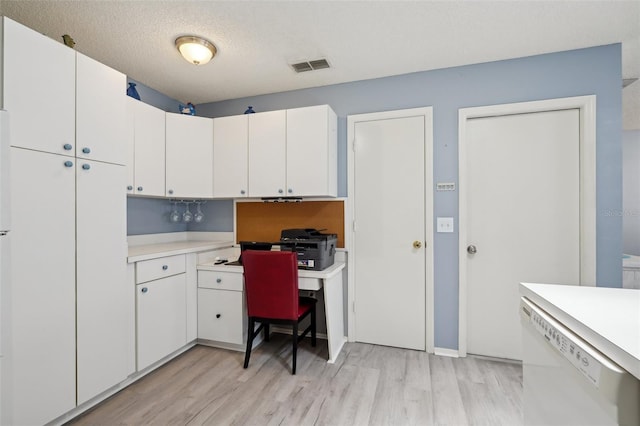 1728 Morelos Rd, The Villages, FL 32159 - office featuring light wood-type flooring, a textured ceiling, and baseboards