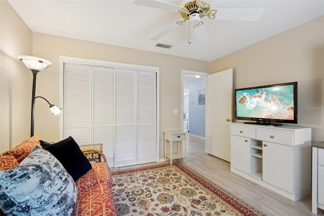 1728 Morelos Rd, The Villages, FL 32159 - bedroom featuring light wood-style flooring, a closet, and ceiling fan