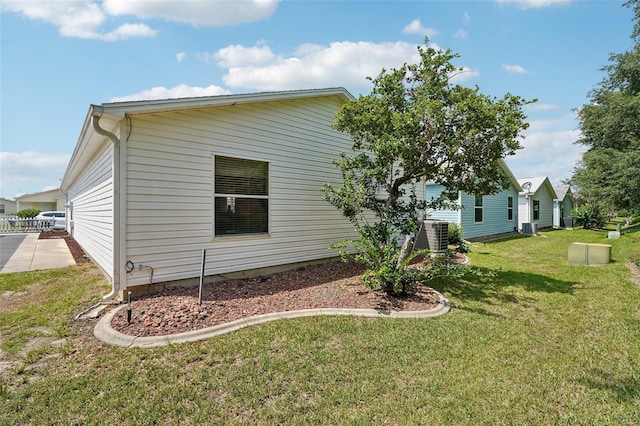 1728 Morelos Rd, The Villages, FL 32159 - view of side of property featuring a yard and cooling unit