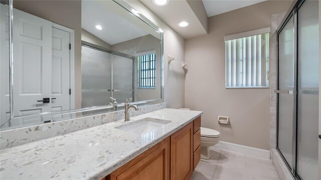 15245 Arabian Way, Montverde, FL 34756 - bathroom with baseboards, toilet, a stall shower, vanity, and recessed lighting