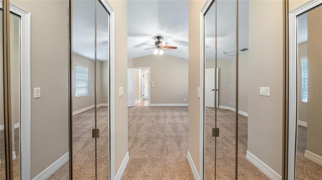 15245 Arabian Way, Montverde, FL 34756 - corridor with carpet floors, vaulted ceiling, and baseboards