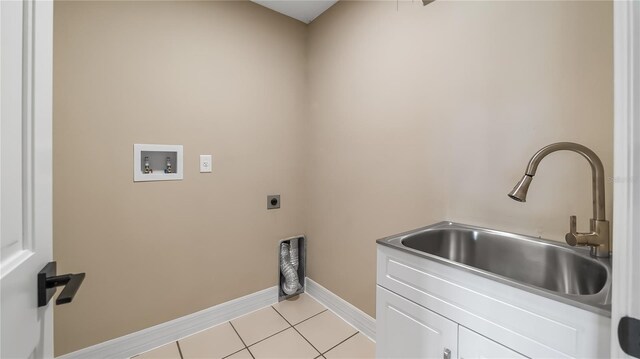 15245 Arabian Way, Montverde, FL 34756 - clothes washing area featuring cabinet space, baseboards, washer hookup, light tile patterned floors, and electric dryer hookup