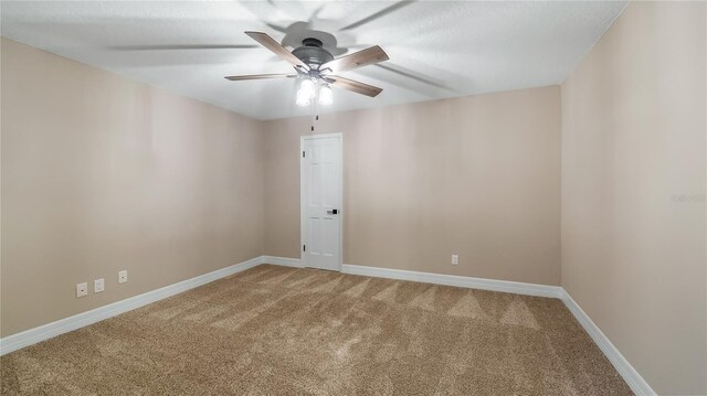 15245 Arabian Way, Montverde, FL 34756 - spare room featuring light colored carpet, ceiling fan, and baseboards