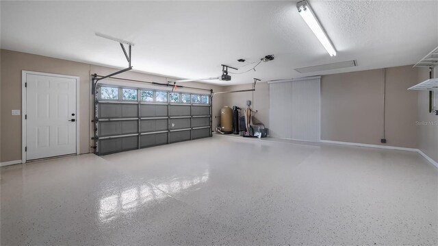 15245 Arabian Way, Montverde, FL 34756 - garage featuring a garage door opener and baseboards