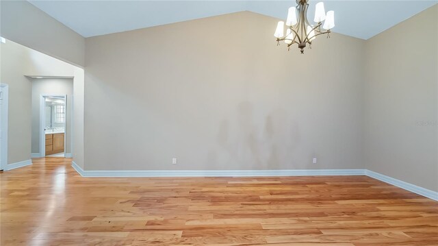 15245 Arabian Way, Montverde, FL 34756 - unfurnished room featuring a chandelier, light wood-type flooring, baseboards, and lofted ceiling