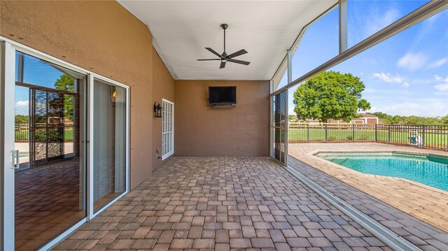 15245 Arabian Way, Montverde, FL 34756 - view of swimming pool featuring a patio area, fence, and ceiling fan