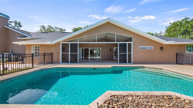 15245 Arabian Way, Montverde, FL 34756 - view of pool featuring fence, a patio, and a sunroom