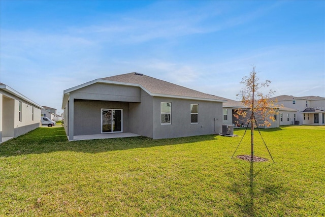 5036 Balsam Falls Rd, Deland, FL 32724 - back of property featuring central air condition unit, a yard, stucco siding, and a shingled roof