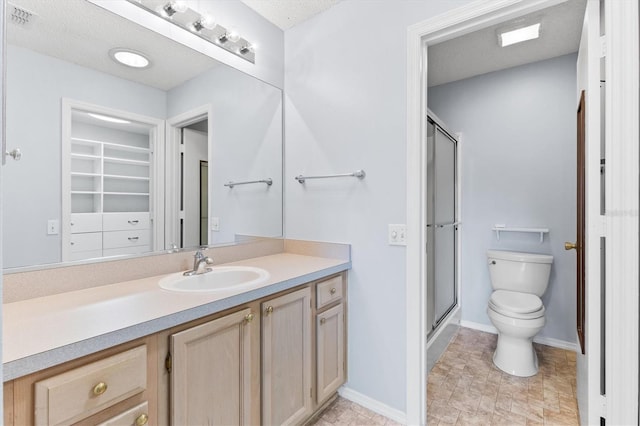 1615 Navidad St, The Villages, FL 32162 - full bathroom featuring toilet, vanity, a shower stall, and baseboards