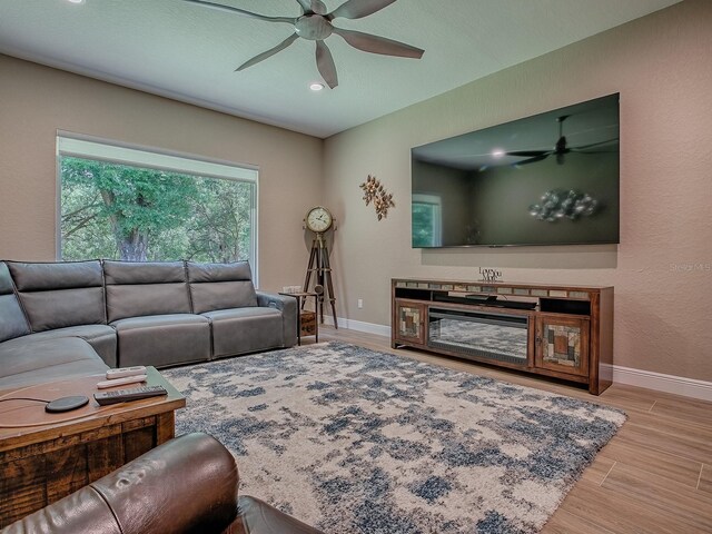10994 SE 168th Loop, Summerfield, FL 34491 - living area with a ceiling fan, baseboards, wood finished floors, and recessed lighting