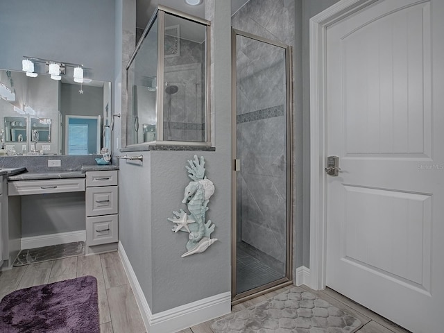 10994 SE 168th Loop, Summerfield, FL 34491 - bathroom featuring vanity, a stall shower, and wood finish floors