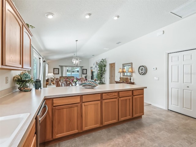 1713 Jadestone Ter, The Villages, FL 32162 - kitchen featuring vaulted ceiling, a sink, light countertops, a peninsula, and brown cabinets