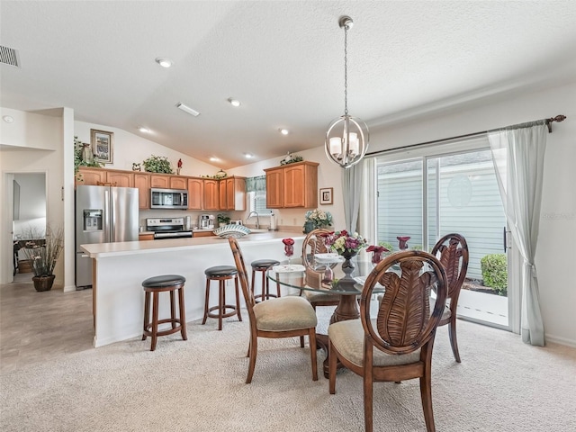 1713 Jadestone Ter, The Villages, FL 32162 - dining area featuring vaulted ceiling, a chandelier, a textured ceiling, light carpet, and recessed lighting